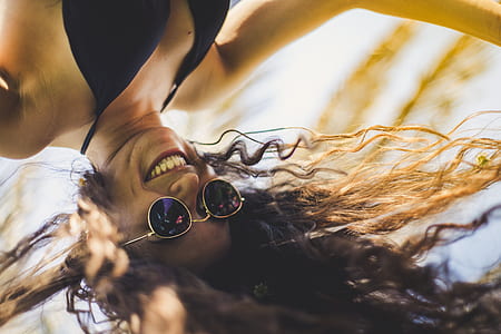 woman wearing black bikini top during daytime thumbnail