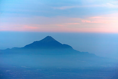 mountain covered by fog during daytime thumbnail