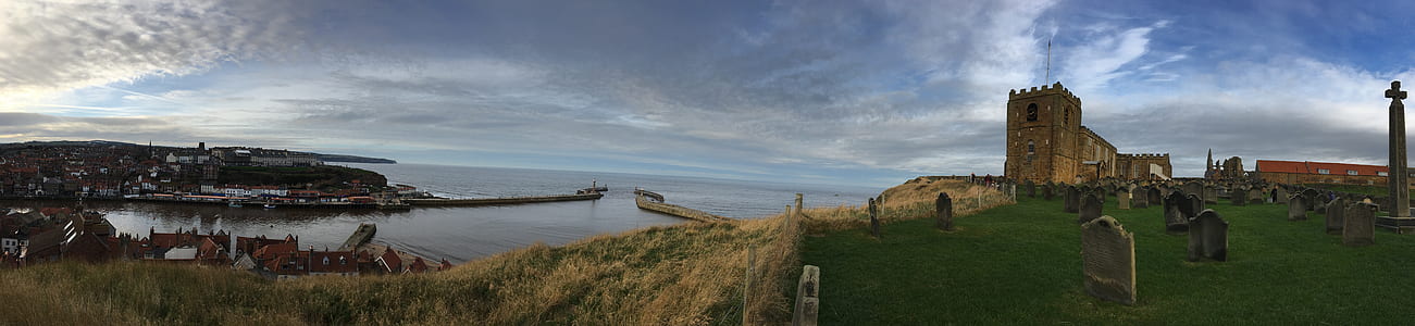 cemetery near sea under blue sky thumbnail