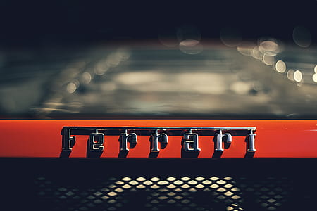 tilt shift lens photography of silver Ferrari emblem thumbnail