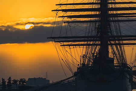 white boat under orange sunset thumbnail