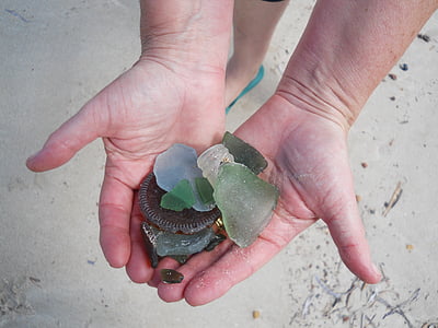 broken glass bottle on person's palm thumbnail