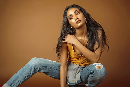 woman wearing yellow top and blue overalls thumbnail
