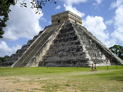 white concrete temple beside green grass field thumbnail