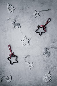 assorted-design keychain on gray concrete pavement thumbnail