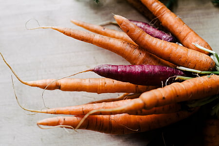 bunch of orange and red carrots on tabletop thumbnail