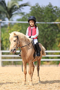 girl riding on horse thumbnail