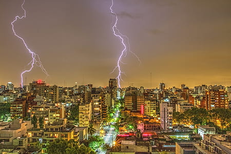 Photography of Thunder Strike Behind City thumbnail