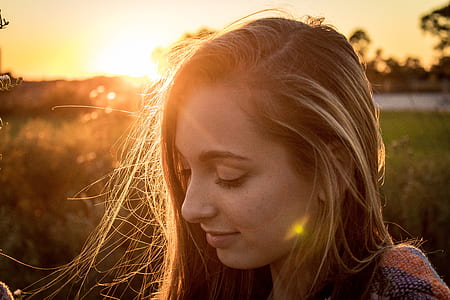 blonde-haired woman looking down thumbnail