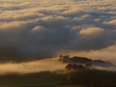 high angle photography of mountain surrounded with clouds thumbnail