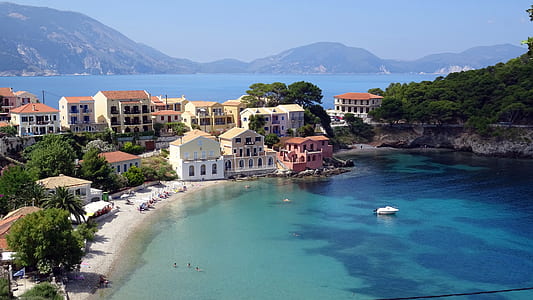 aerial photography of village near sea thumbnail