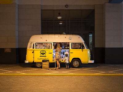 woman and boy standing in front of van thumbnail