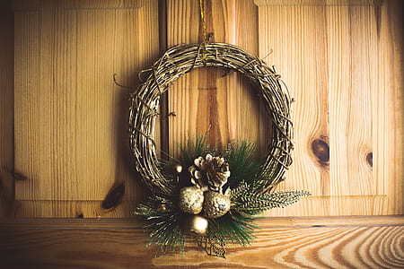 branch wreath with conifer hanging on wall thumbnail