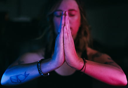 person praying while close his eyes thumbnail