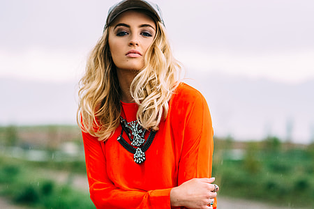 woman in red long-sleeved shirt during daytime thumbnail