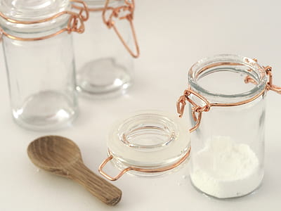 powder in clear glass jar beside clamp lid beside and spoon thumbnail