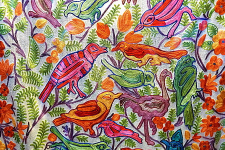 red and multicolored bird and flower print textile thumbnail