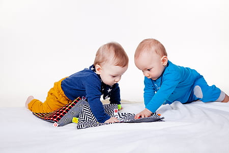 two babies on bed thumbnail