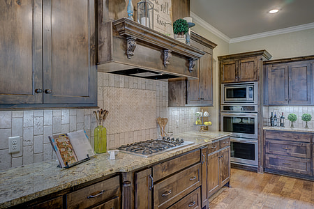brown wooden kitchen coutertop and ovens thumbnail