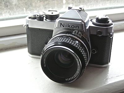 Nikon DSLR camera near glass window thumbnail