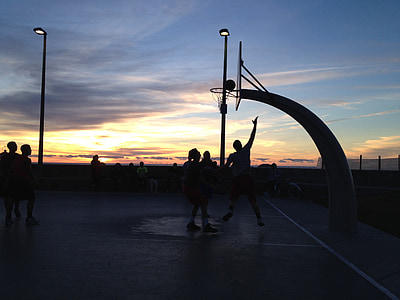 silhouette of people playing basketball thumbnail