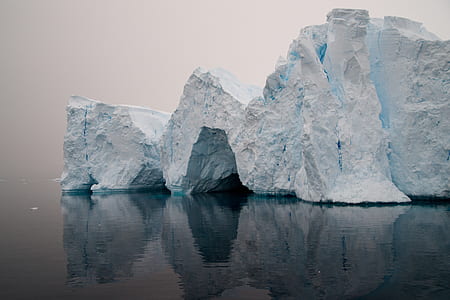white rock surrounded body of water thumbnail