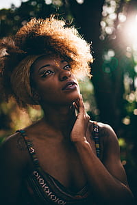 bokeh photo of woman holding her chin thumbnail