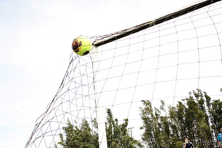 time-lapse photography of soccer ball striking goalie thumbnail
