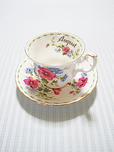 white and pink floral ceramic teacup on saucer thumbnail