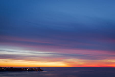 landscape photography of body of water during golden hour thumbnail