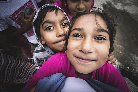selective focus photography of smiling girl wearing pink shirt thumbnail