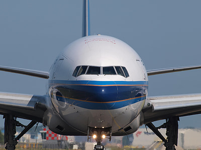white and blue airliner thumbnail