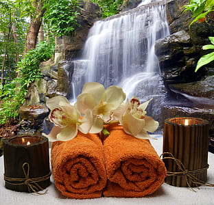 two brown towels with candles thumbnail