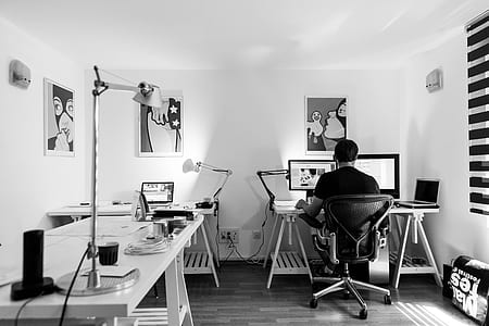 grayscale photo of man using computer thumbnail