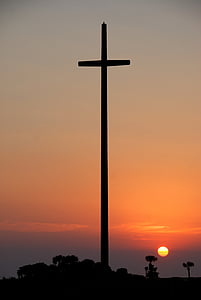 silhouette of cross during golden hour thumbnail