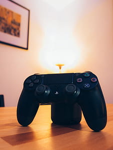 Black Sony Ps4 Dualshock 4 On Tabletop thumbnail
