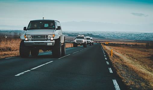 grey vehicles on road thumbnail