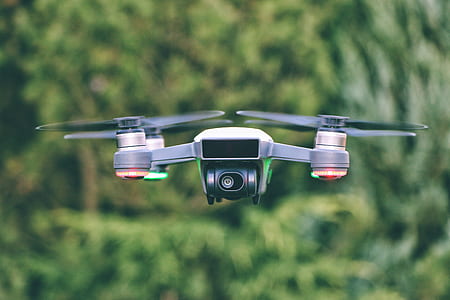 selective focus photography of black and white mini quadcopter thumbnail