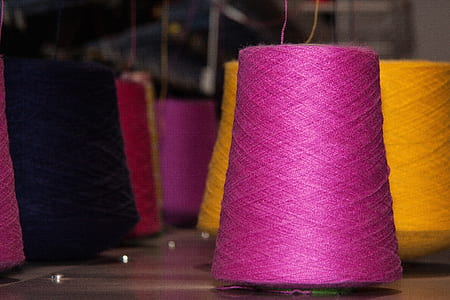selective focus photo of a pink thread thumbnail