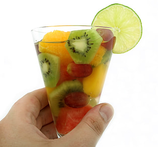sliced fruit filled clear drinking glass thumbnail