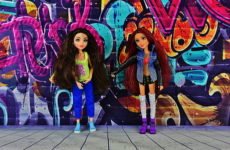 two Bratz dolls beside graffiti thumbnail