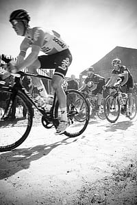 grayscale photo of cyclists thumbnail