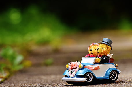 two bears riding vehicle figurine thumbnail