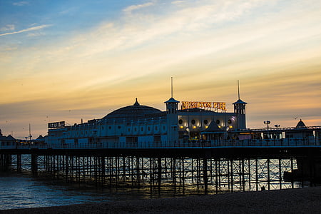 white dome building on dock during golden hour thumbnail