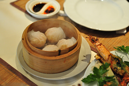 steam dumpling near vegetable and plate thumbnail
