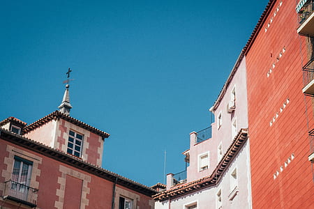 beige and white concrete buildings under blue sky during daytime thumbnail