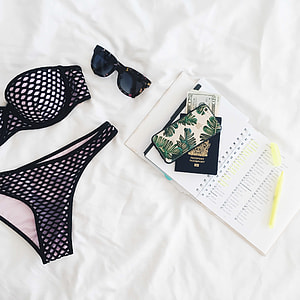 women's black and white underwear beside black sunglasses thumbnail