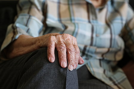 selective focus photo of person with wrinkled hand thumbnail