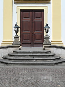 black candle lantern beside door thumbnail