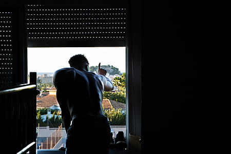 man looking outside house and pointing up thumbnail